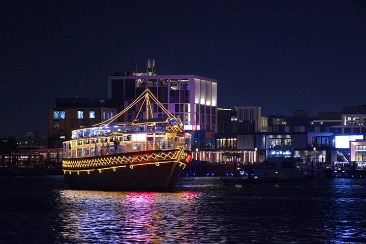 Bask in the shimmering lights of Dubai Marina while enjoying a delicious buffet dinner aboard a traditional Dhow surrounded by stunning skyscrapers on a magical night cruise.